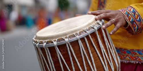 Wallpaper Mural music performance, focused dhol with a players hand mid-beat, blurred street dancers in the backdrop Torontodigital.ca