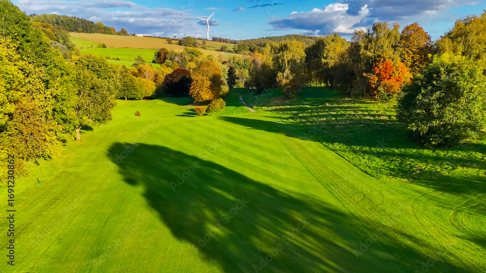 Obraz premium Drone view of autumn golf course in Germany.