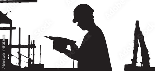 Silhouette of a man wearing a cap using a handheld drill in a workshop worker
