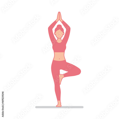 Woman practices tree pose in yoga studio, finding balance and inner peace through mindful movement and focused breathing, promoting wellness.