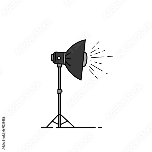 Studio light illuminates the scene in a photography studio, casting bright rays and creating a professional atmosphere for capturing images, showcasing equipment.