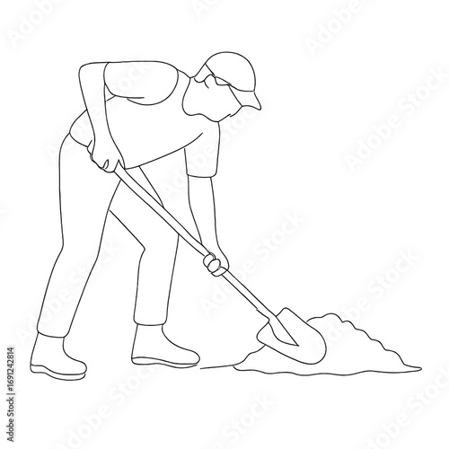 Man using shovel to spread concrete in construction site  
