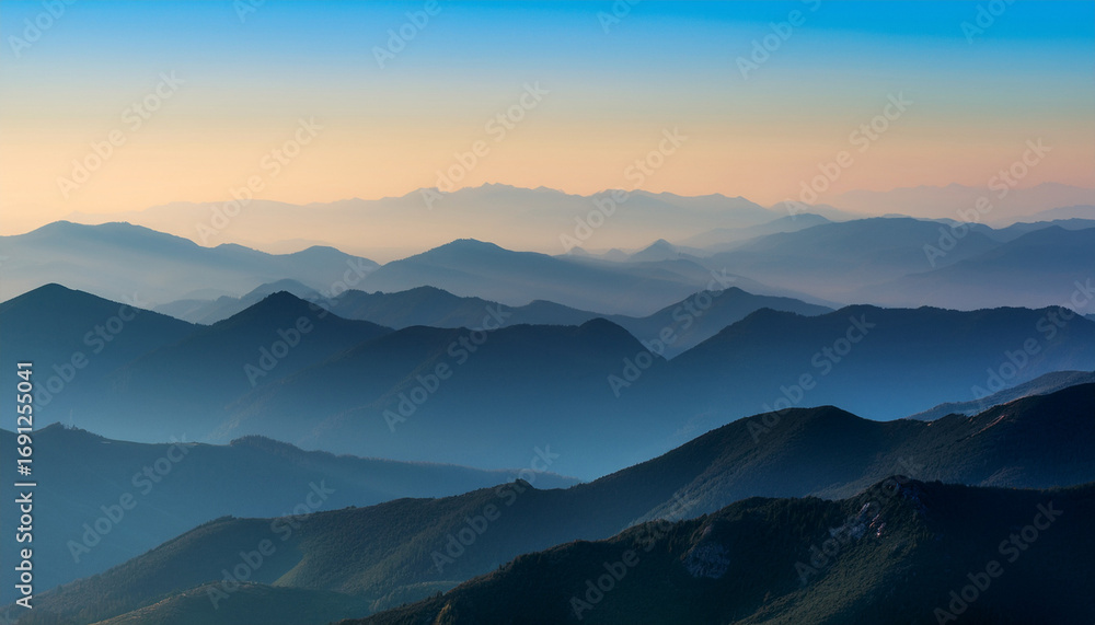 Obraz premium Layered Mountain Range In Soft Light With A Gradient Sky Backdrop
