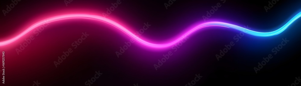 Fototapeta premium A vibrant, curving neon light trail with a gradient of pink, purple, and blue hues against a dark backdrop.