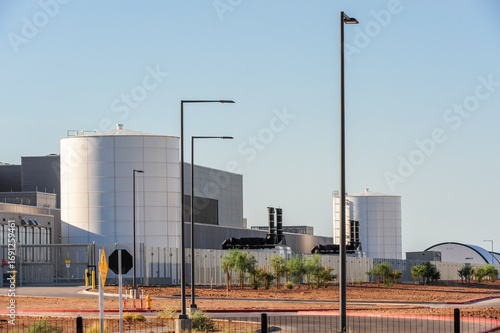 фотографія Exterior view of a large data center campus with cylindrical storage tanks, peri
