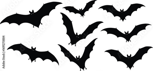 Collection of black flying bat silhouettes isolated on white, perfect for Halloween, spooky themes, gothic designs, horror projects, and fantasy art.