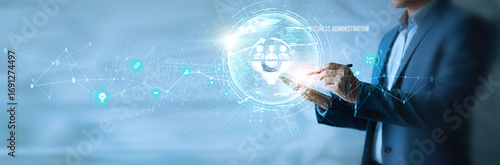 Photos Businessman using tab business administration icon with global network