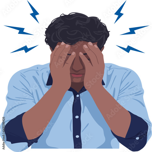 A stressed businessman holds his head with a tired expression of pain and worry