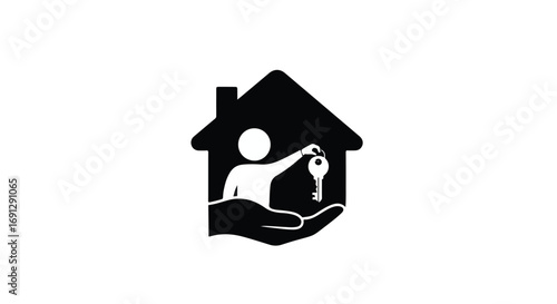 Person holding house key inside silhouette of a house, representing home ownership and security