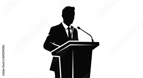 Silhouette of a person speaking confidently at a podium during a presentation.