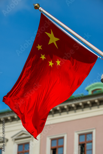 Photography Chinese national flag waving in blue sky.