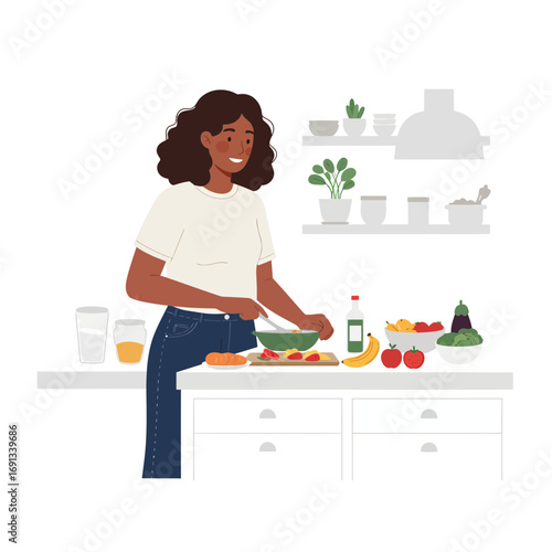 Vibrant young woman cooking healthy meal with fresh produce in her bright, modern kitchen, creating a delicious salad for a balanced lifestyle