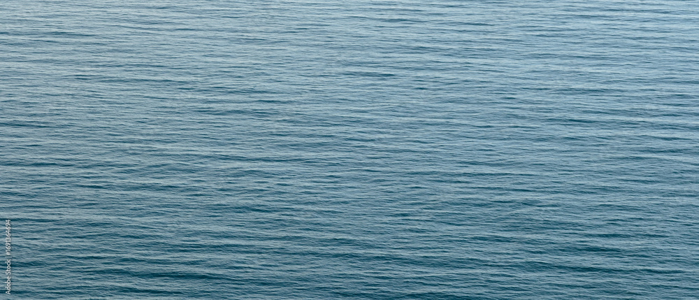 Fototapeta premium Blue calm sea as texture background for web banner template page design.