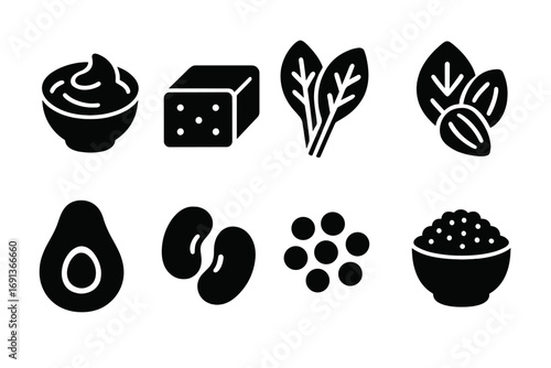 Vegan Food Icons. Solid, filled icon set of vegan foods: hummus, tofu block, leafy greens, nuts, avocado, beans, lentils, quinoa