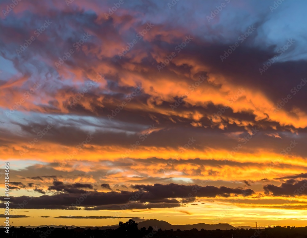 Fototapeta premium Dramatic sunset sky with vibrant clouds