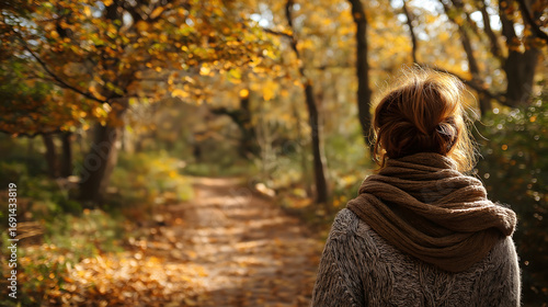 Autumn Forest Path Journey: Woman Exploring Tranquil Nature in Solitude