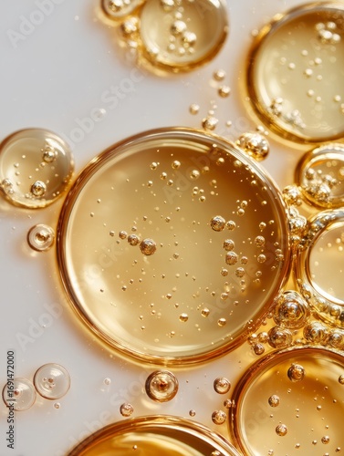 Close-up view of golden gel droplets with bubbles