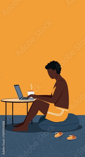 Relaxed person working remotely on a laptop at home, enjoying a hot drink. Depicts modern work-life balance and comfortable productivity.