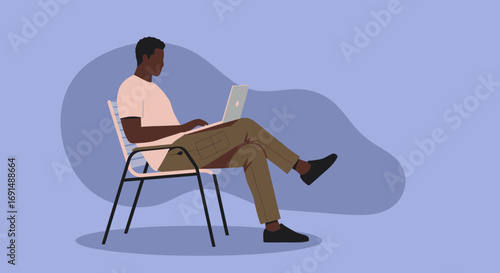 African American man engaged in work or study on his laptop, representing remote productivity and a connected digital lifestyle.