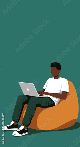 Young Black man comfortably working on a laptop while sitting on a bean bag chair. Ideal for remote work, casual computing, and digital lifestyle concepts.