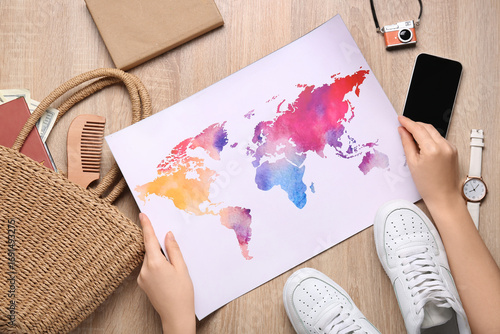 Female hands with map and t...