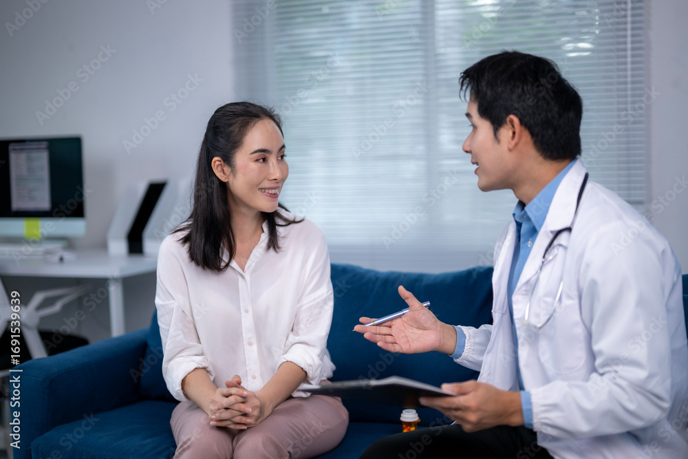 Fototapeta premium Doctor explaining treatment to patient in medical office
