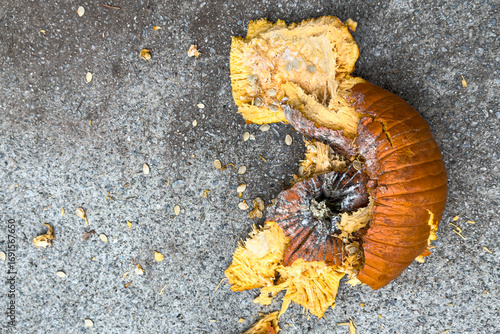 Pumpkin lies in pieces on pavement after being smashed
