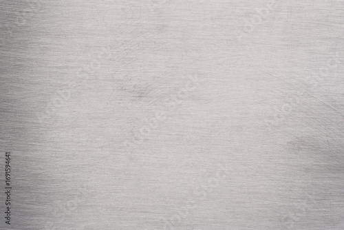Abstract background texture of brushed silver metal