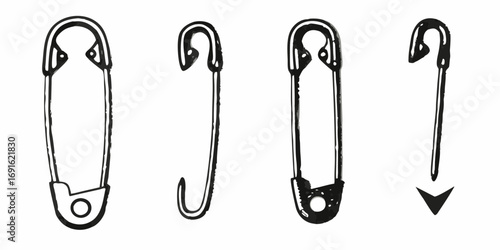 Four different safety pins shown in a row against a white background