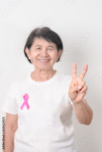Wallpaper Mural Elderly woman with pink Ribbon for Pink October Breast Cancer Awareness month, May Women Health, August World Breastfeeding week, Nursing Mothers, Pregnancy and Infant Loss Remembrance, Stillbirth Torontodigital.ca