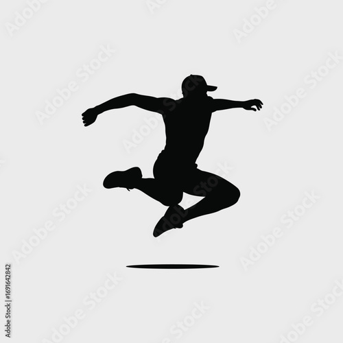 Athletic man leaping with arms outstretched silhouette jumping