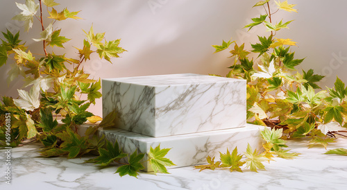 Two marble platforms surrounded by green and yellow maple leaves decor