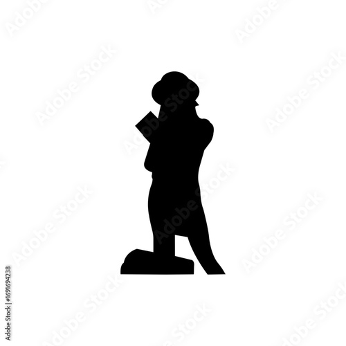 Silhouette of a woman kneeling, holding a book.