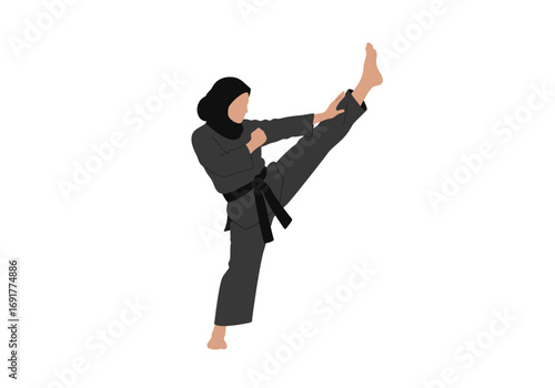 Powerful Woman in Hijab Executes a High Kick in Martial Arts.