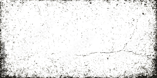 Vintage textured black and white grunge wall with dirty ink splashes on a rough surface