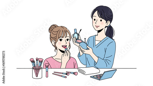 Three young women in bathrobes applying makeup and skincare products together at a table in a bright clean room