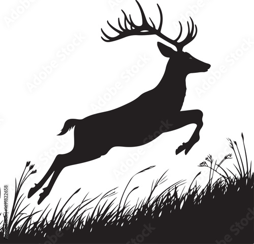 Silhouette of a leaping deer with antlers over grass
