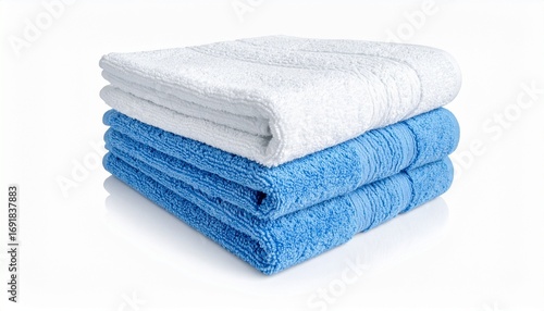 Folded towels on white surface
