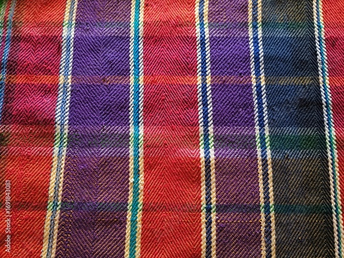 Colorful woven plaid fablic texture tartan pattern close up