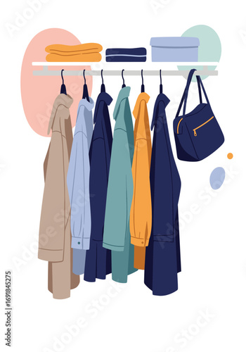 Organized wardrobe with hanging garments and accessories on a shelf above