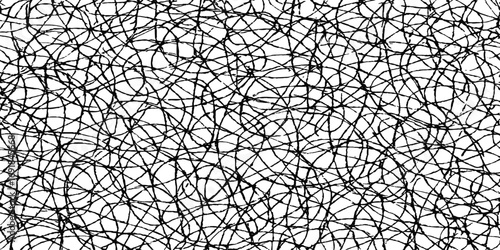 Chain-link fence with geometric barbed wire pattern texture and a grunge wall background