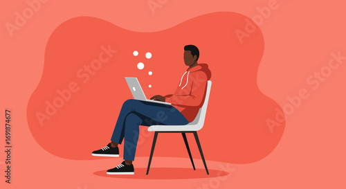 Young man in casual wear focused on his laptop, representing remote work, online learning, and digital lifestyle trends.