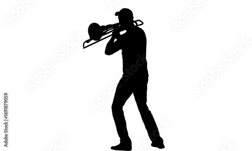 Silhouette of a person playing a trombone.