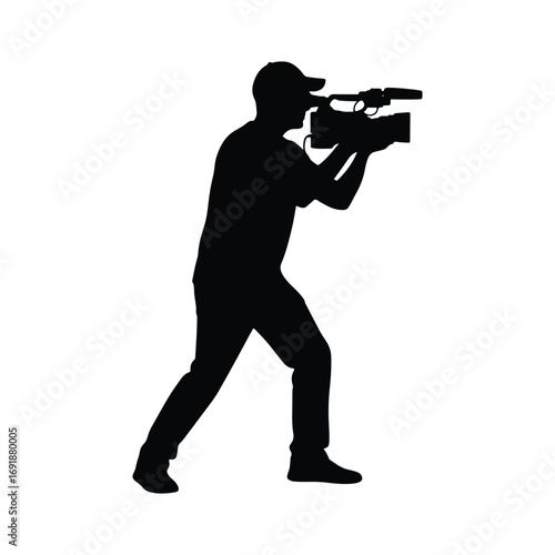 Black silhouette of cameraman recording video with camera.