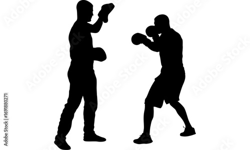 Silhouette of two boxers sparring in a boxing ring, training.