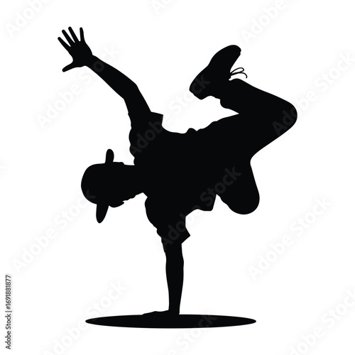 Black silhouette of a breakdancer performing a freeze on one hand dancing hip hop