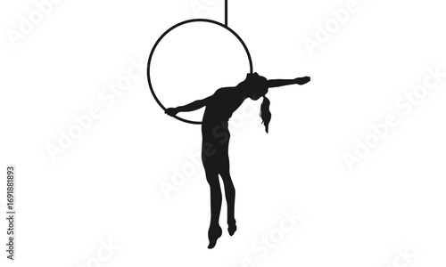 Silhouette of an aerialist performing on a lyra hoop, showcasing flexibility and strength in an acrobatic pose.