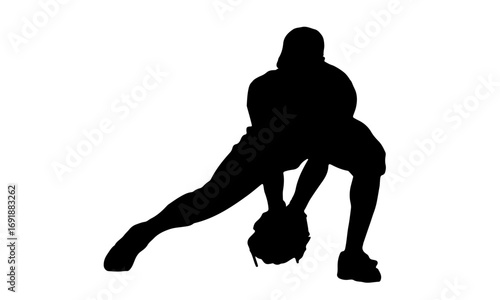 Silhouette of a baseball player in a defensive stance, ready to field a ball.