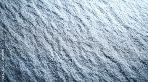 Light gray textured surface with subtle waves