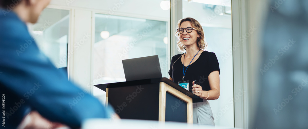 custom made wallpaper toronto digitalConfident woman leading presentation at business event